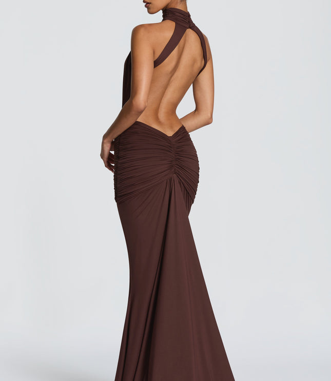 Side back view of brown ruched maxi dress showing halter neckline and open back