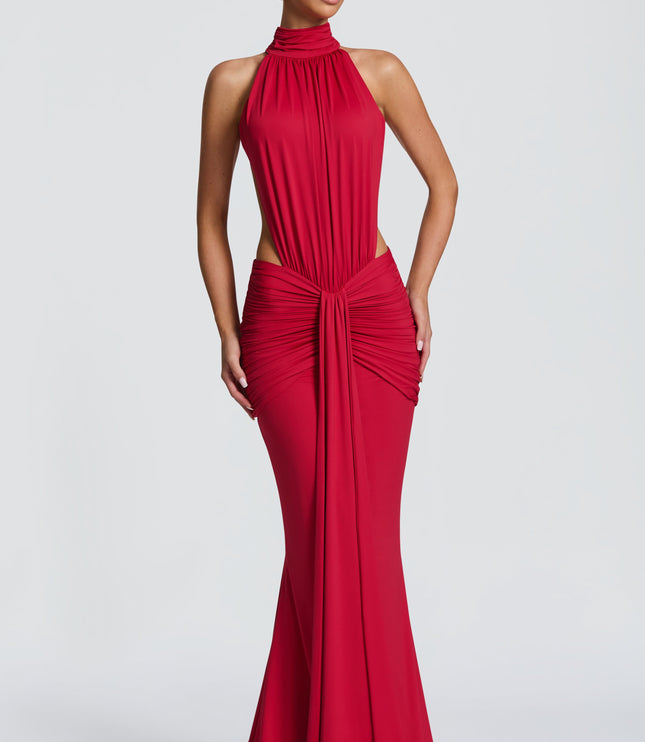 Front view of a red ruched halter maxi dress with high neckline and side cutouts