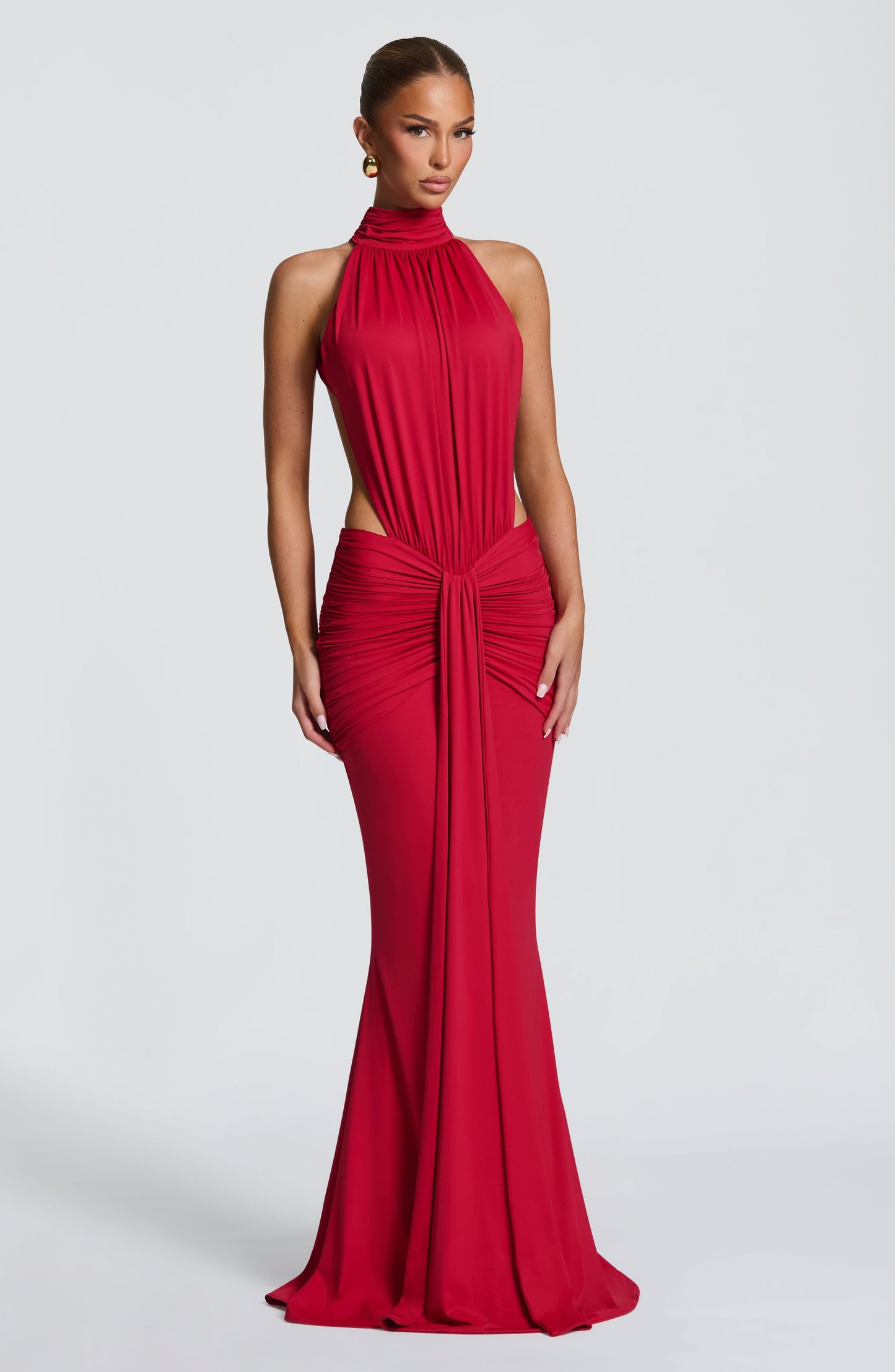 Front close-up of a red halter maxi dress with draped neckline and ruched waist detail