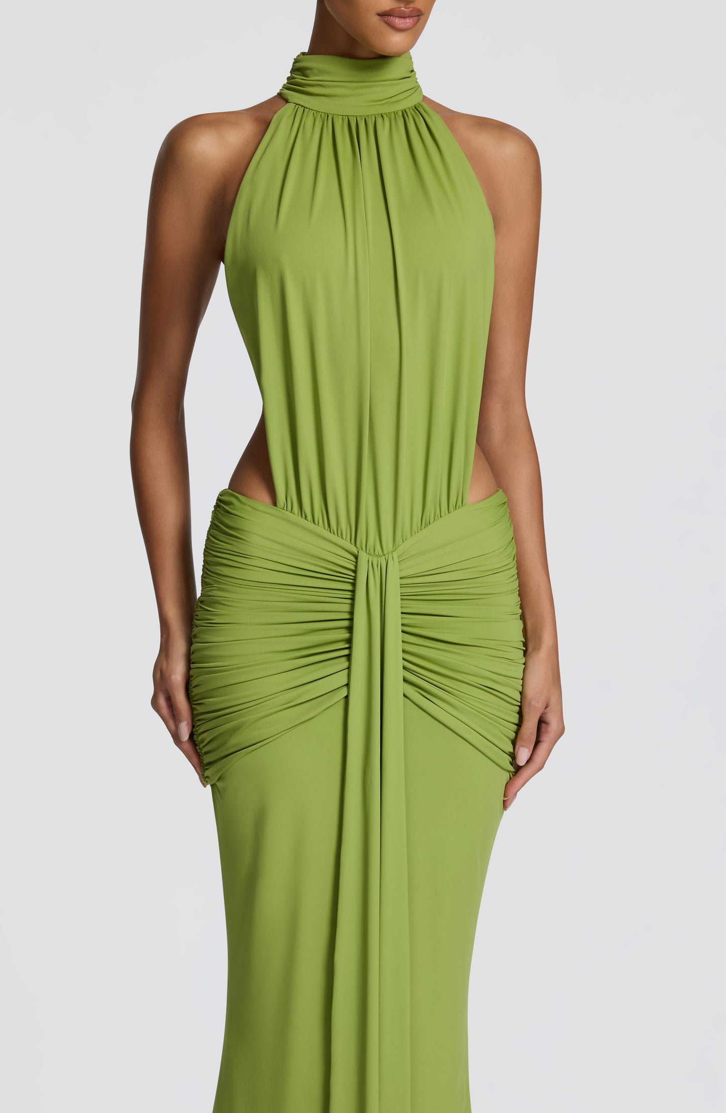 Close-up front of green halter dress with gathered neckline and ruched bodice