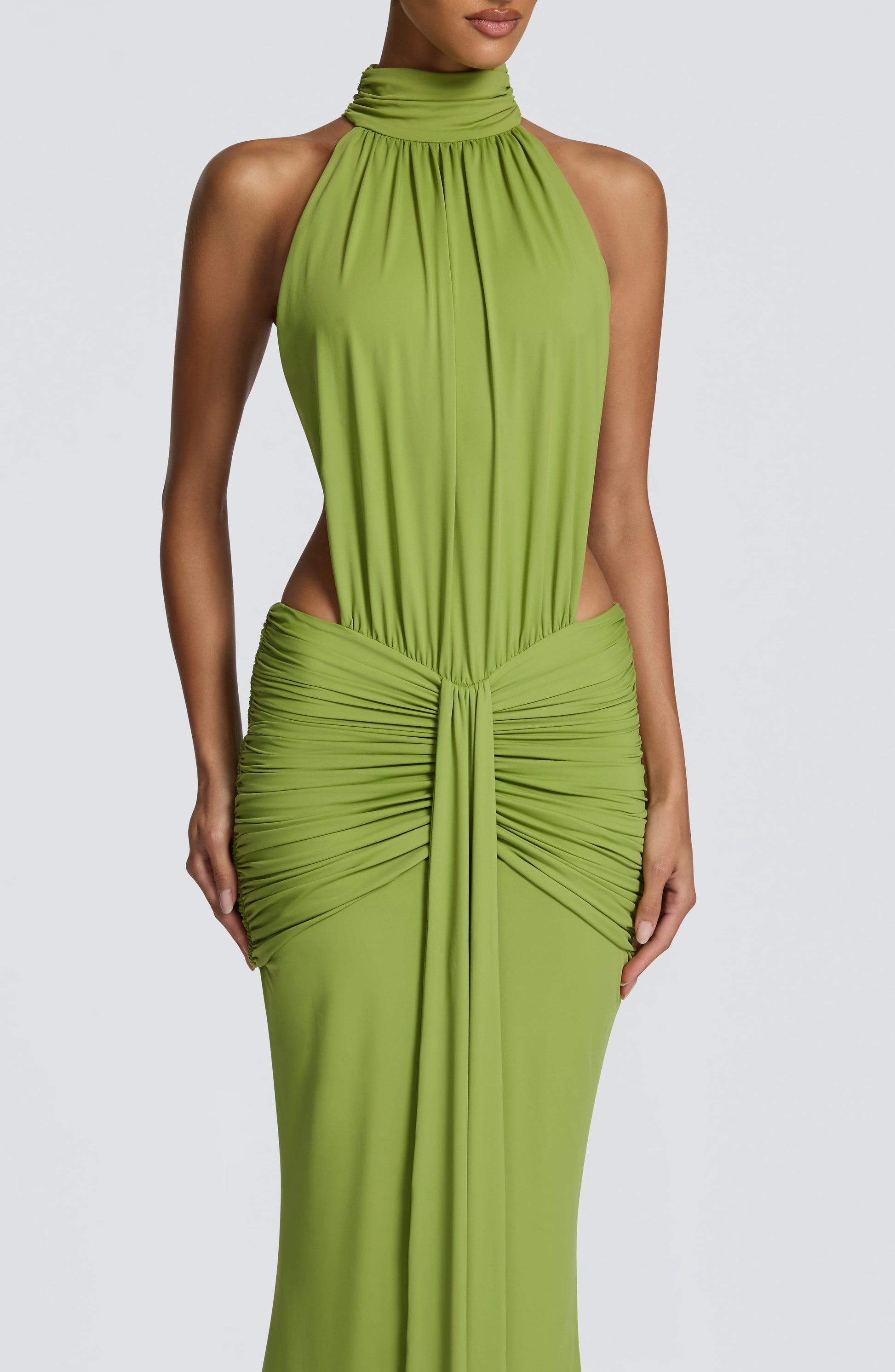 Close-up front of green halter dress with gathered neckline and ruched bodice