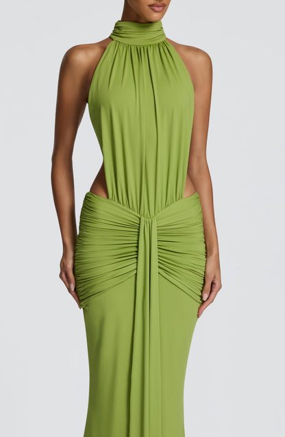 Close-up front of green halter dress with gathered neckline and ruched bodice