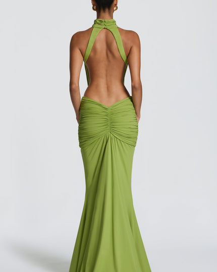 Back view of green ruched maxi dress with open back and fitted skirt