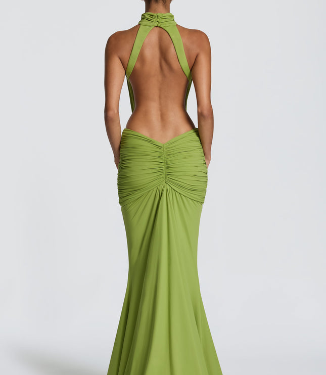 Back view of green ruched maxi dress with open back and fitted skirt