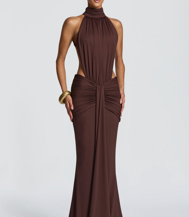 Front view of brown ruched halter maxi dress with high neck and side cutouts