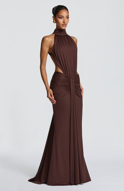 Back view of brown formal maxi dress with open back and ruched hip detail