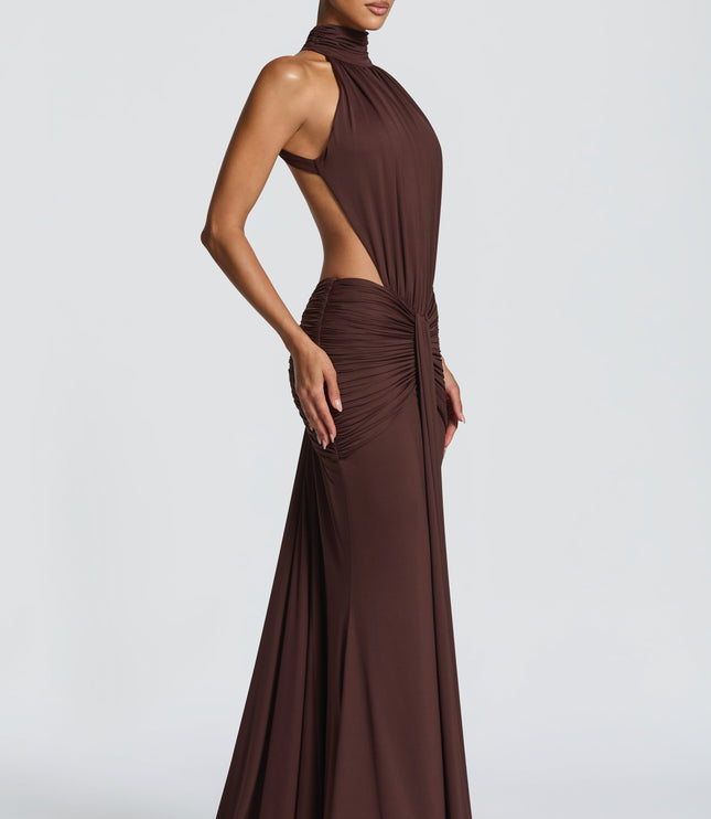 Close-up front of brown ruched halter dress with gathered waist and side cutouts