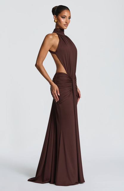 Close-up front of brown ruched halter dress with gathered waist and side cutouts