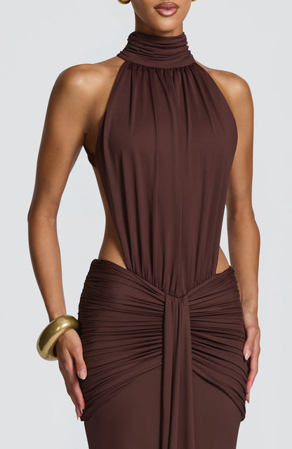 Rear view of brown formal maxi dress with low open back and ruched skirt