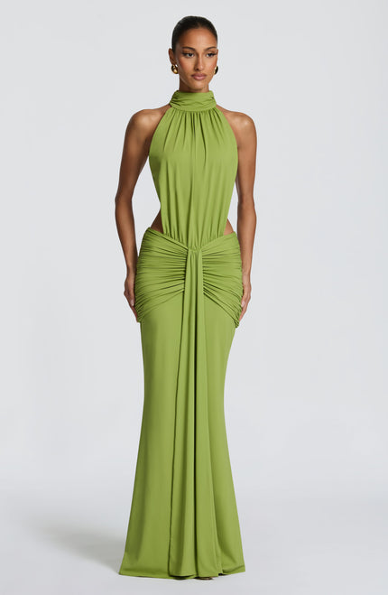 Front view of green ruched halter maxi dress with high neckline and side cutouts