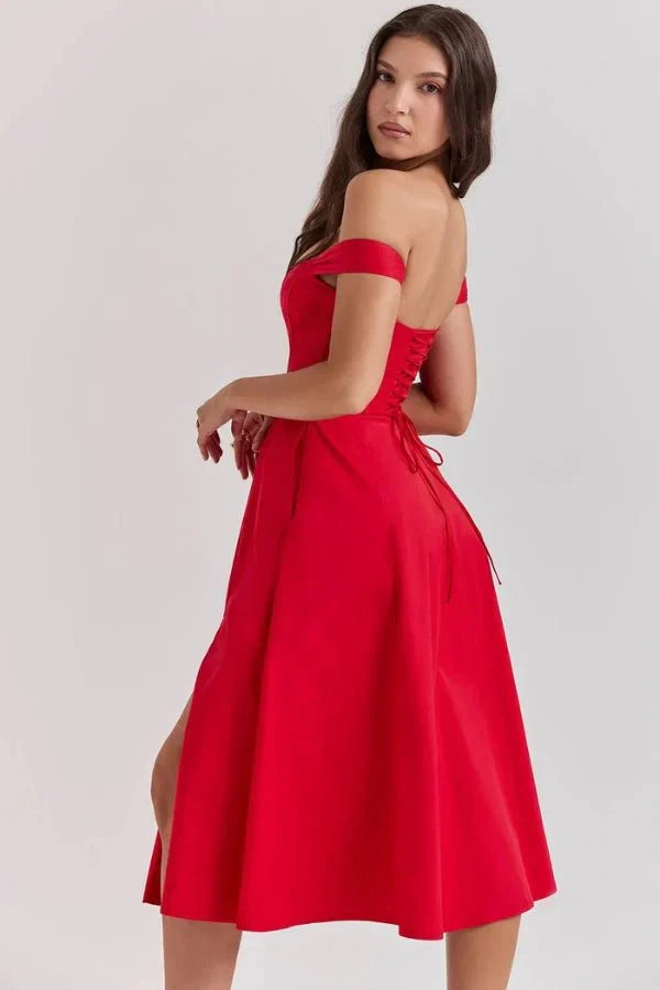 Side back view of red off shoulder midi dress with open shoulders and flared formal skirt