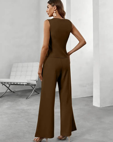 Black sleeveless vest and wide leg pants set shown in a bright formal room with tailored fit