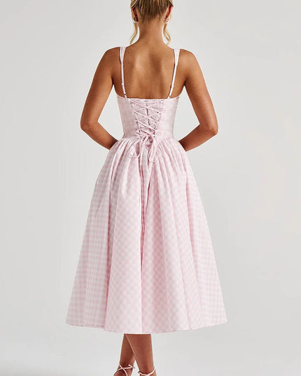Back view of pink gingham midi dress showing lace-up corset detail