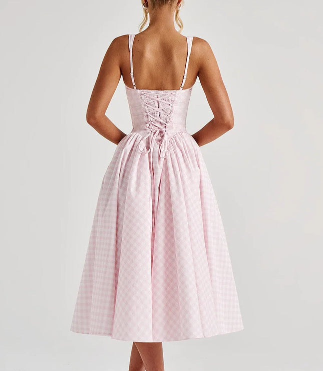 Back view of pink gingham midi dress showing lace-up corset detail