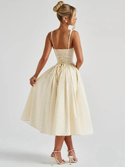 Pink gingham square neck midi dress front view with pleated skirt and pockets