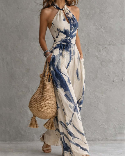 Side angle cream and navy abstract print halter neck wide leg jumpsuit, flowy summer fit