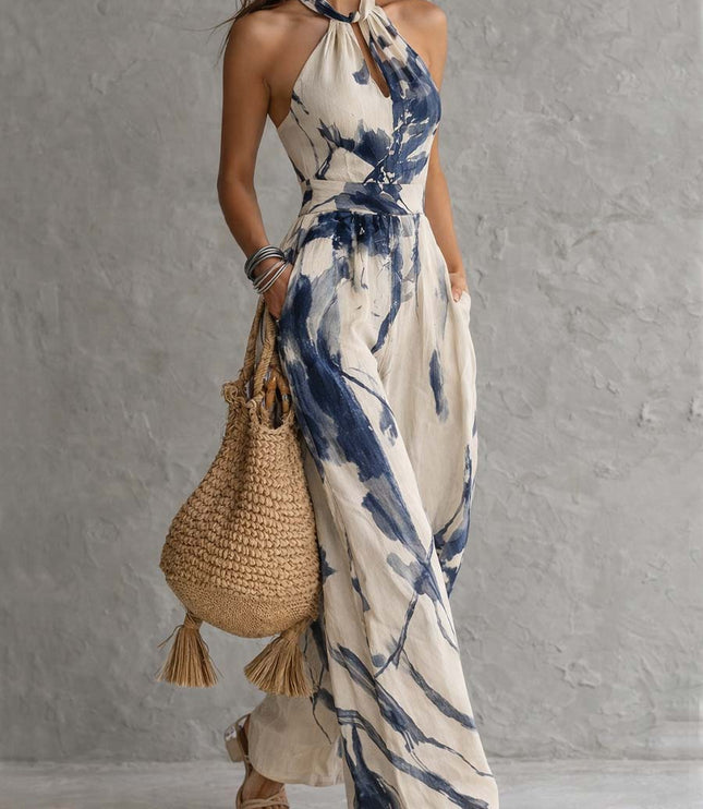 Side angle cream and navy abstract print halter neck wide leg jumpsuit, flowy summer fit