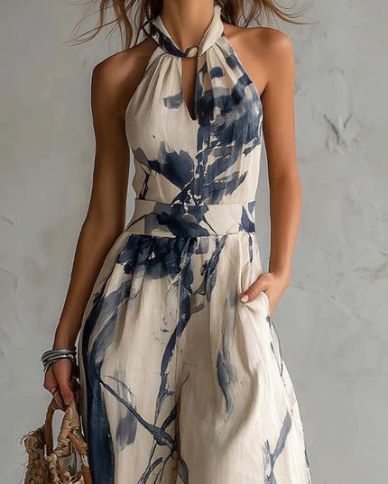 Close-up of halter neckline and waist on cream navy printed jumpsuit, keyhole detail