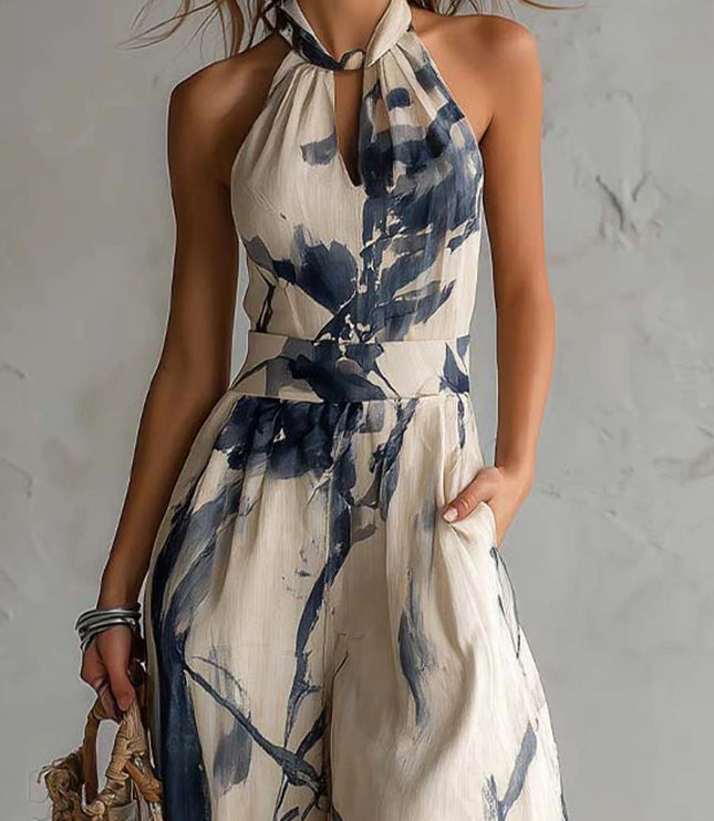 Close-up of halter neckline and waist on cream navy printed jumpsuit, keyhole detail