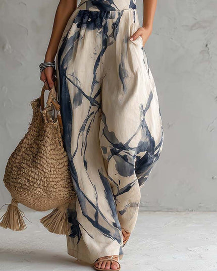 Detail of wide leg pants and pocket on cream navy printed jumpsuit, lightweight summer style