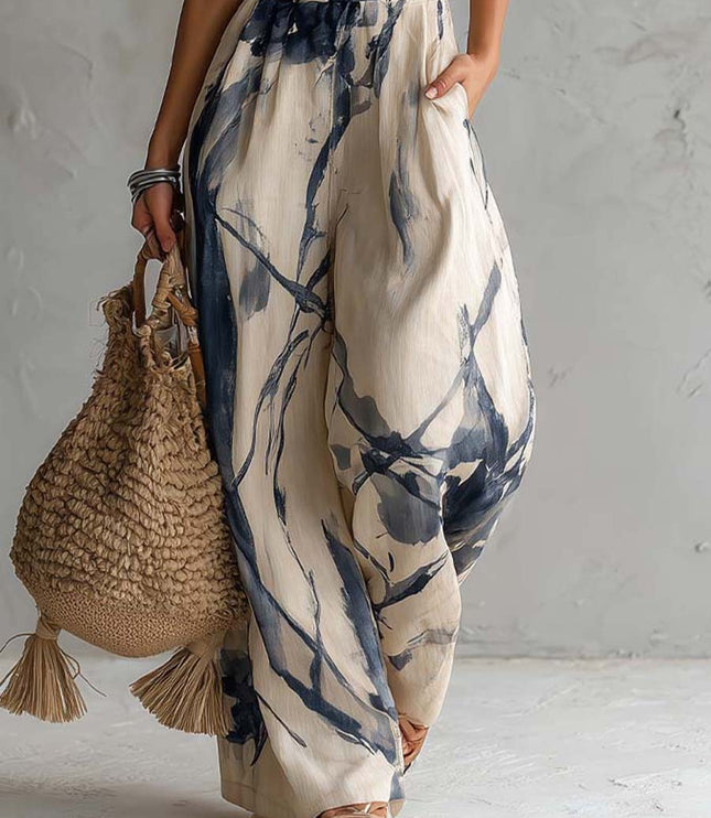 Detail of wide leg pants and pocket on cream navy printed jumpsuit, lightweight summer style