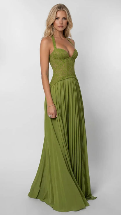 Side view of green lace corset maxi dress with flowing pleated skirt