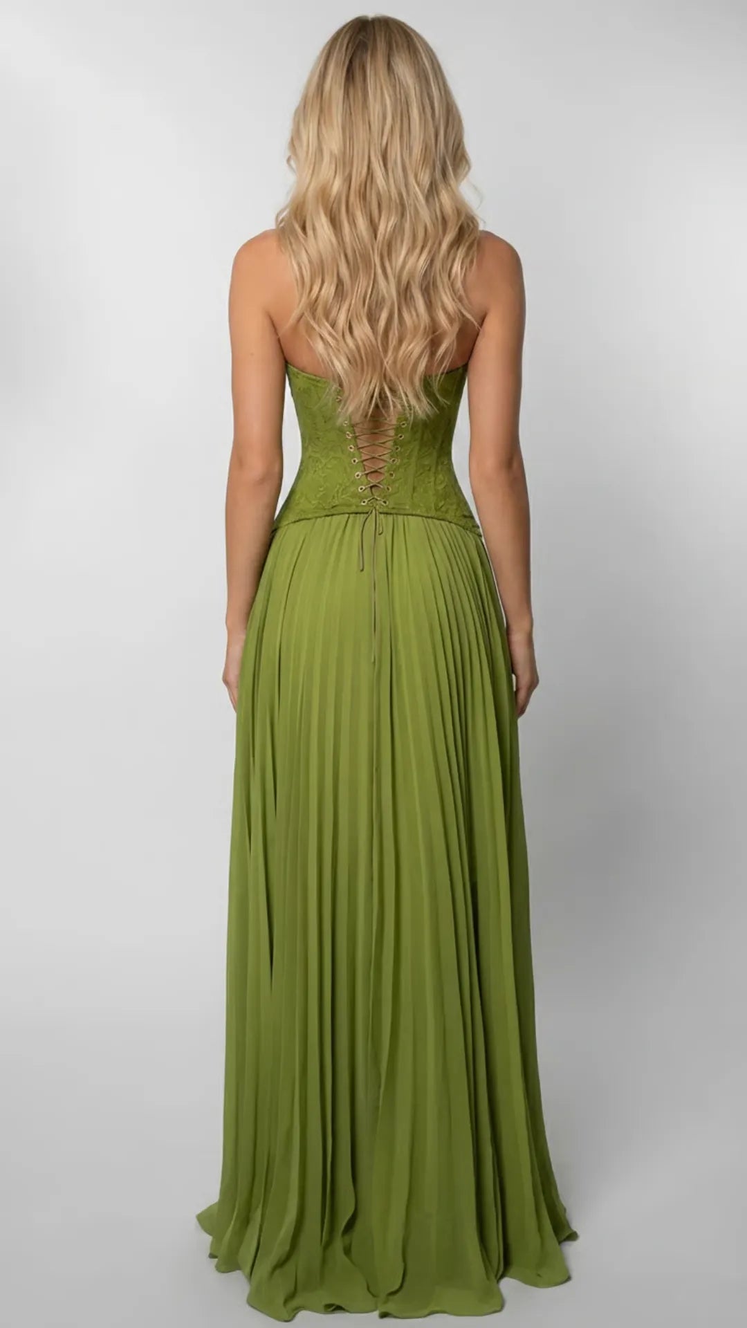 Back view of green halter maxi dress showing lace-up corset detail