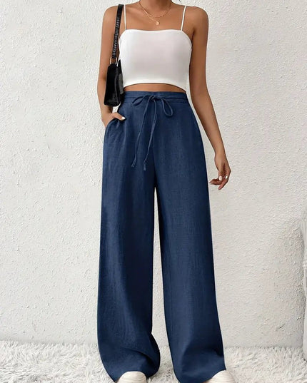 Navy blue linen wide leg pants for women with high waist, drawstring tie, and flowy legs