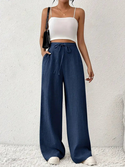 Navy blue linen wide leg pants for women with high waist, drawstring tie, and flowy legs