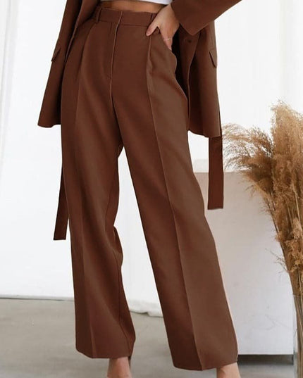 Brown high waisted wide leg linen pants with pleats and a relaxed straight fit