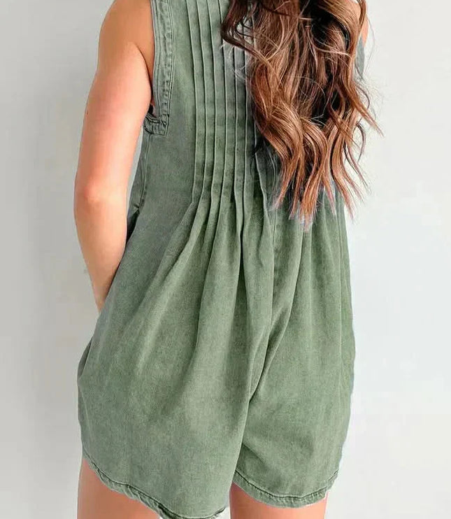 Back view of olive green mini denim romper with gathered pleats, sleeveless design, and loose shorts