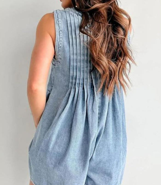 Back view of light blue mini denim romper with pleated yoke, sleeveless design, and loose fit