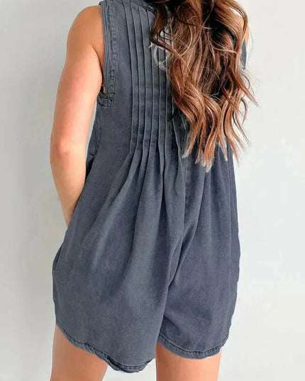 Back view of dark denim romper for women with gathered back pleats and sleeveless mini shorts