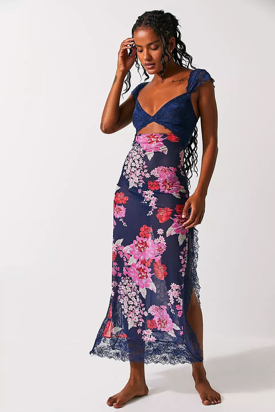 Navy floral cutout midi dress with lace bodice, side slit, and sheer hem for wedding guest attire