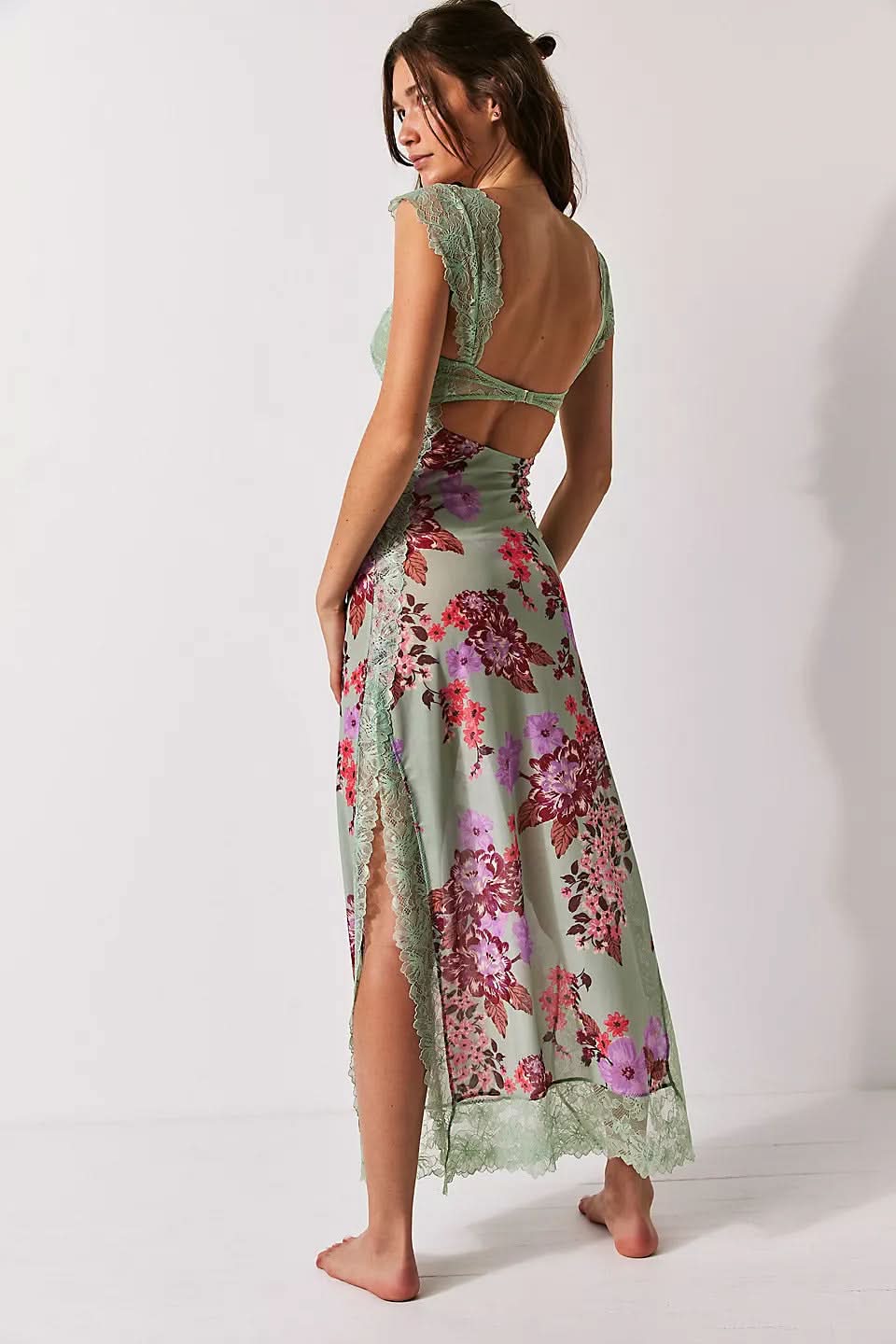 Green floral cutout midi dress with lace trim, open back, and side slit for wedding guest wear