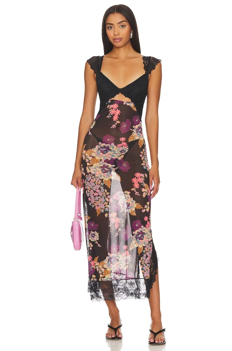 Black floral cutout midi dress with sheer skirt, lace trim, and sleeveless wedding guest style