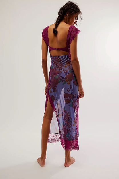 Back view of purple floral cutout midi dress with open back, lace straps, and sheer hem