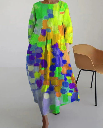 Long sleeve maxi dress with bright abstract print in neon green, yellow, orange, and purple