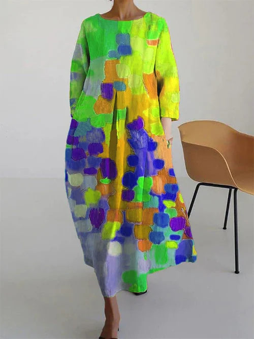 Long sleeve maxi dress with bright abstract print in neon green, yellow, orange, and purple