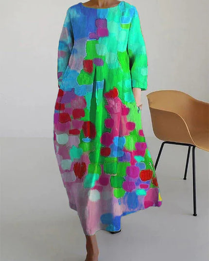 Women's abstract print maxi dress featuring blue, aqua, green, and red blocks with long sleeves