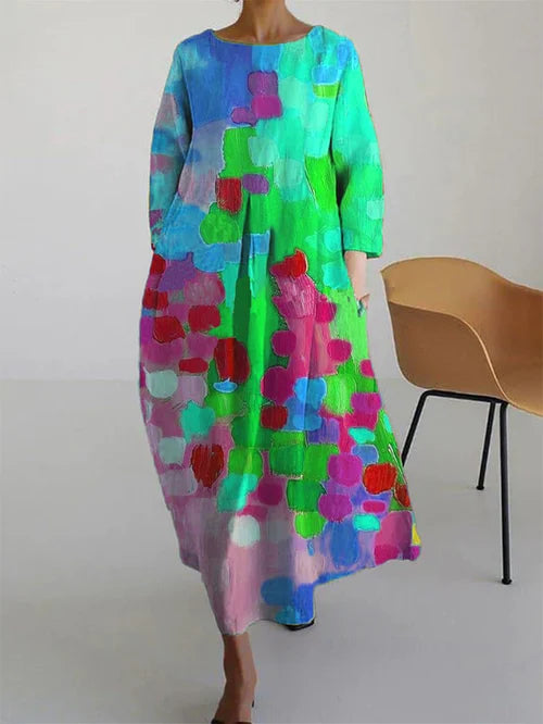 Women's abstract print maxi dress featuring blue, aqua, green, and red blocks with long sleeves
