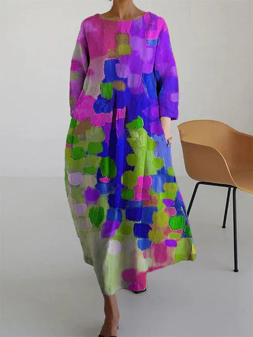 Women's abstract print long sleeve maxi dress in pink, purple, green, and blue with loose flowy fit