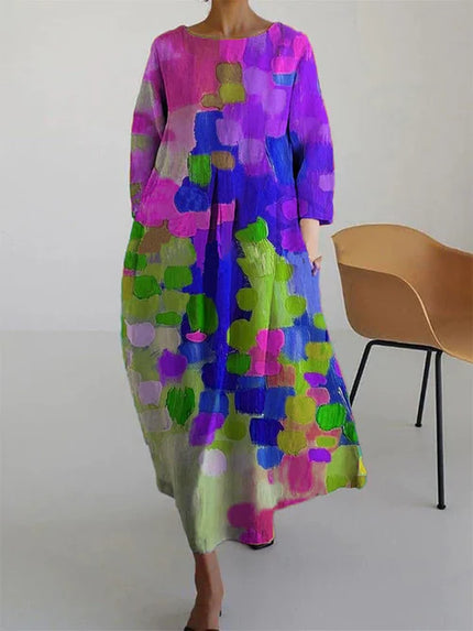 Women's abstract print long sleeve maxi dress in pink, purple, green, and blue with loose flowy fit
