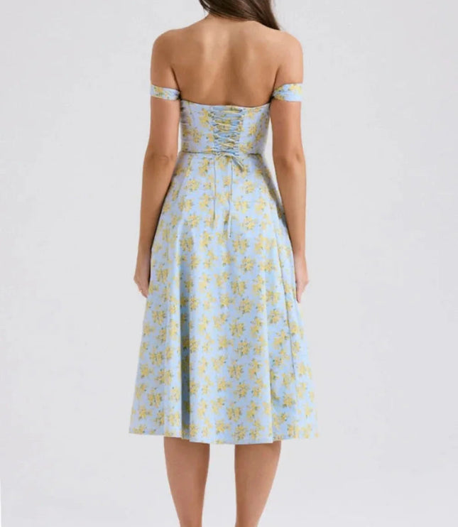 Back view of a blue floral off shoulder midi dress with ruched back and midi length