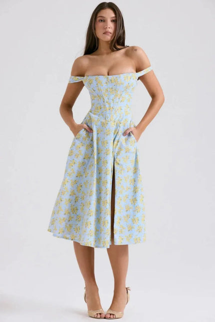 Front view of a blue floral off shoulder midi dress with slit and pockets