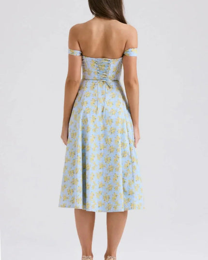 Back view of a blue floral off shoulder midi dress with ruched back and midi length