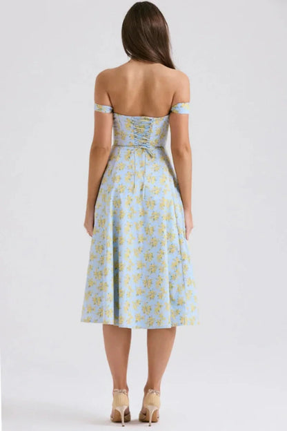 Back view of a blue floral off shoulder midi dress with ruched back and midi length