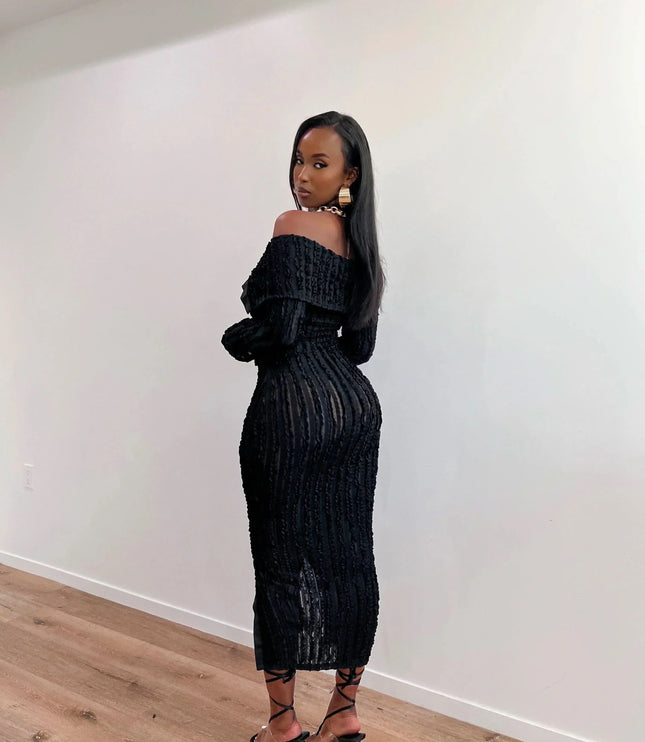 Black off shoulder midi dress with long sleeves, textured ribbed detail, and front slit