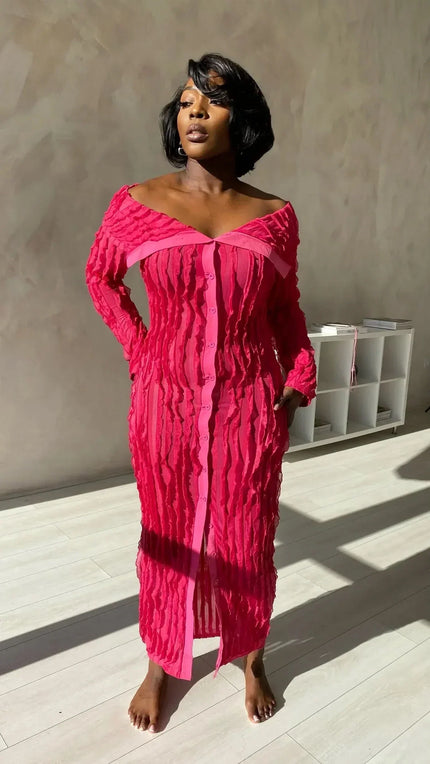 Back view of black off shoulder midi dress with fitted silhouette and ribbed knit texture
