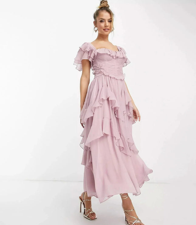 Front view of blush pink wedding guest ruffle midi dress with square neckline and tiered chiffon skirt